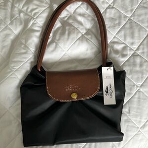 Brand new with tag    Never opened